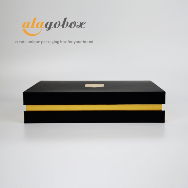 black and gold bookstyle box
